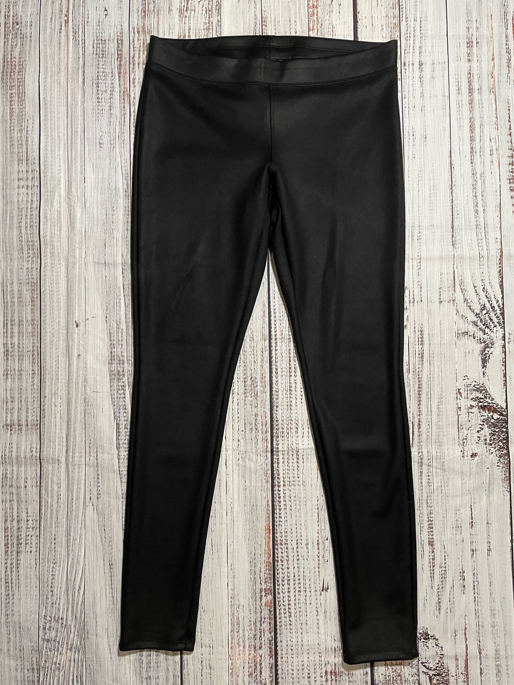 Express faux leather leggings in black. Size M